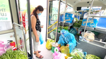 Buses sell vegetables around HCM City