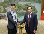 Deputy PM Le Minh Khai meets with Grab CEO