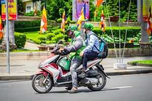 Gojek resumes ride-hailing motorbike services , prioritises safety