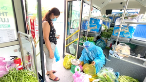 Buses sell vegetables around HCM City